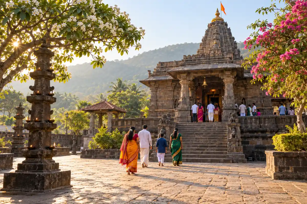 Visitors approaching a stone temple through a tree-lined courtyard
