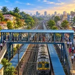 Suburban railway footbridge above tracks between urban neighbourhoods